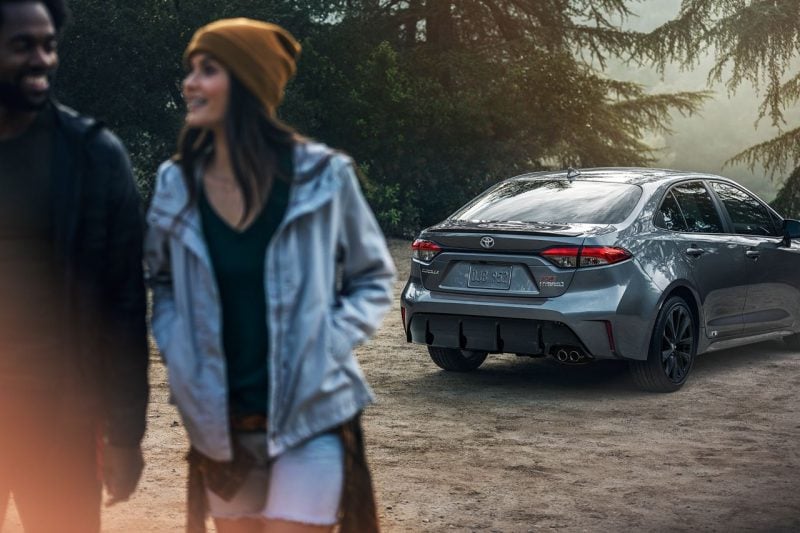 Couple on a road trip with a Toyota