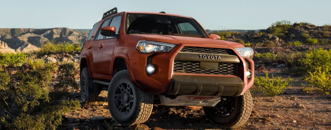 Toyota 4Runner TRD Pro in red parked off-road in a desert