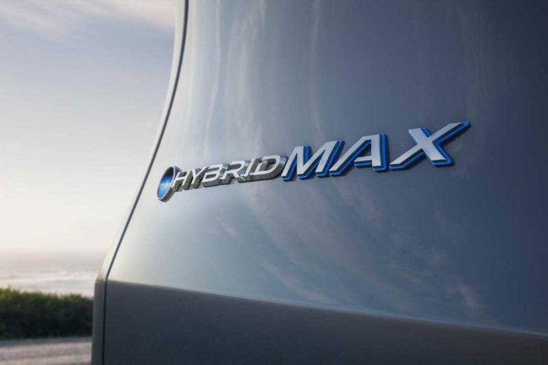 The logo nameplate of a 2024 Grand Highlander HybridMAX vehicle.