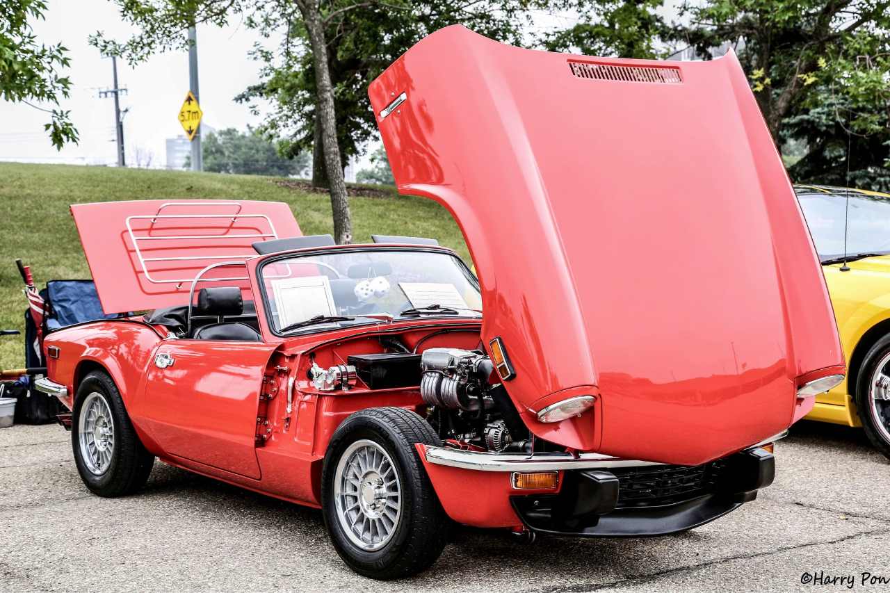 A vintage, classic red car on display at our community event held in Edmonton.
