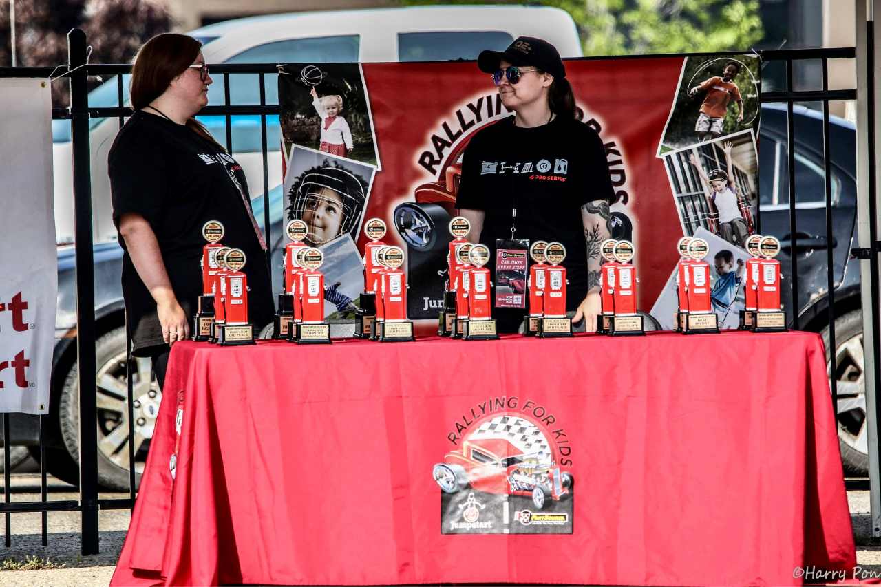 A stall at the car show, showcasing all the awards up for grabs for car submissions.