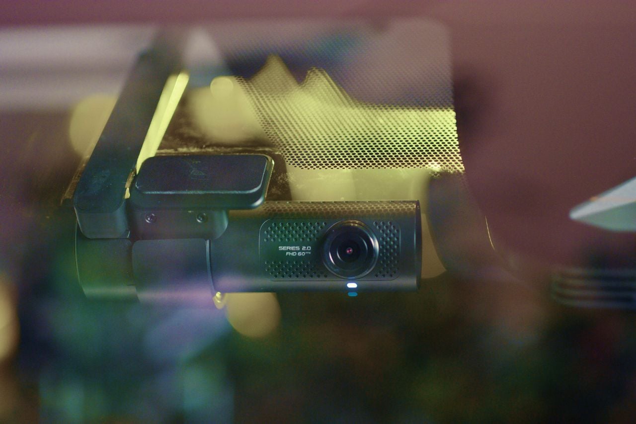 A close-up of the Toyota Dash camera in the windshield of a vehicle.