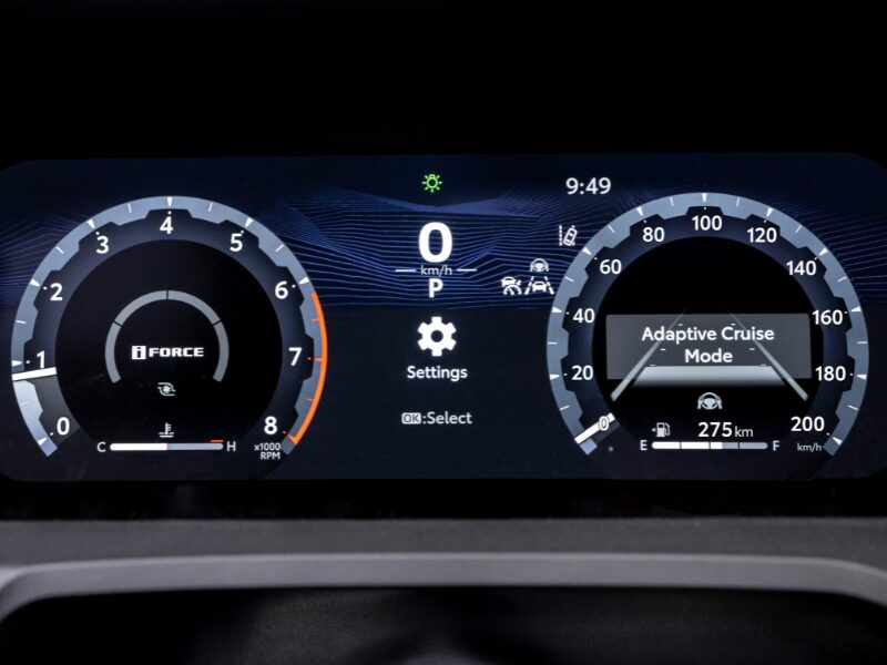 Dashboard screen behind the steering wheel of a Toyota vehicle
