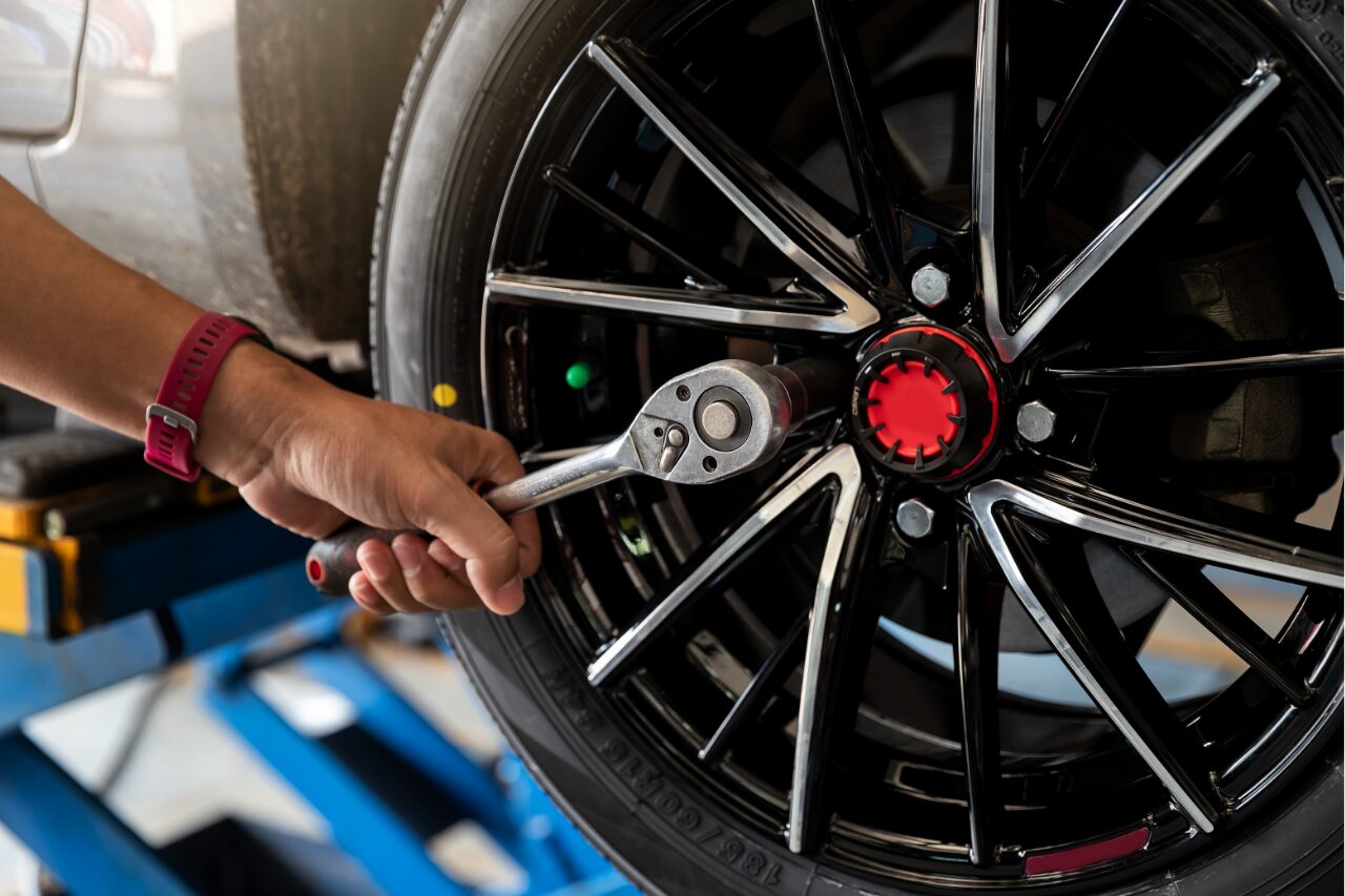 technician inspecting ties of the car