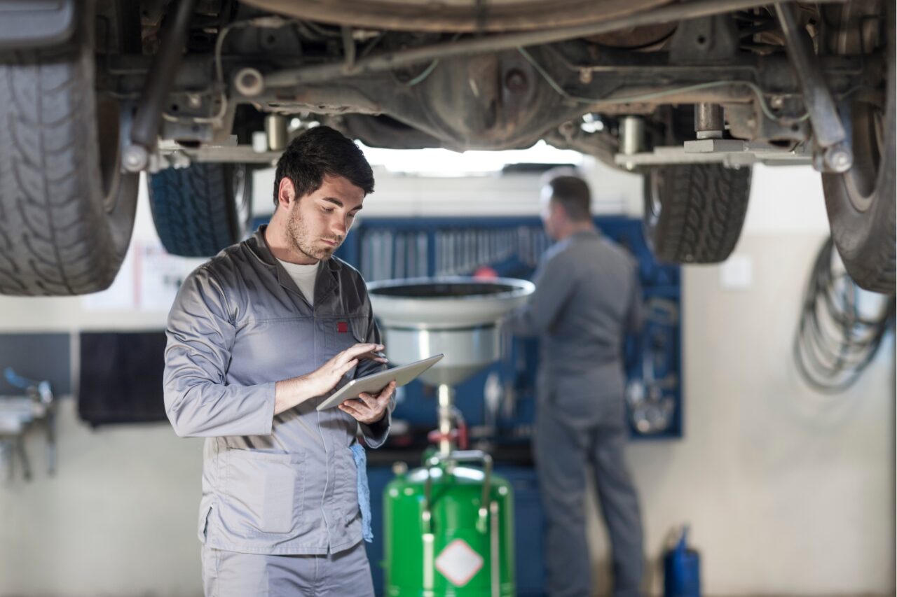 technician inspecting vehicle