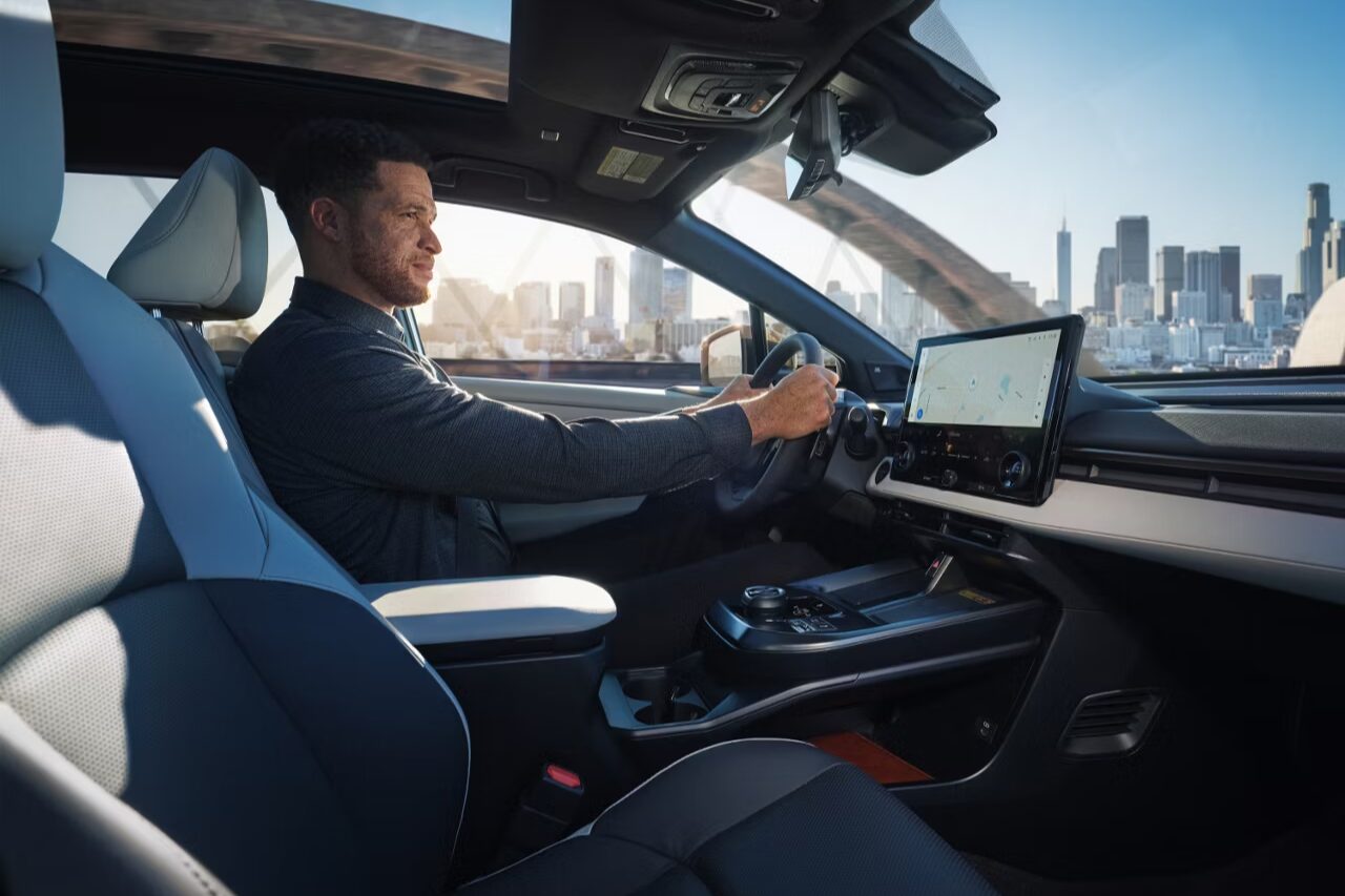 Interior shot of a Toyota car and driver driving in the city