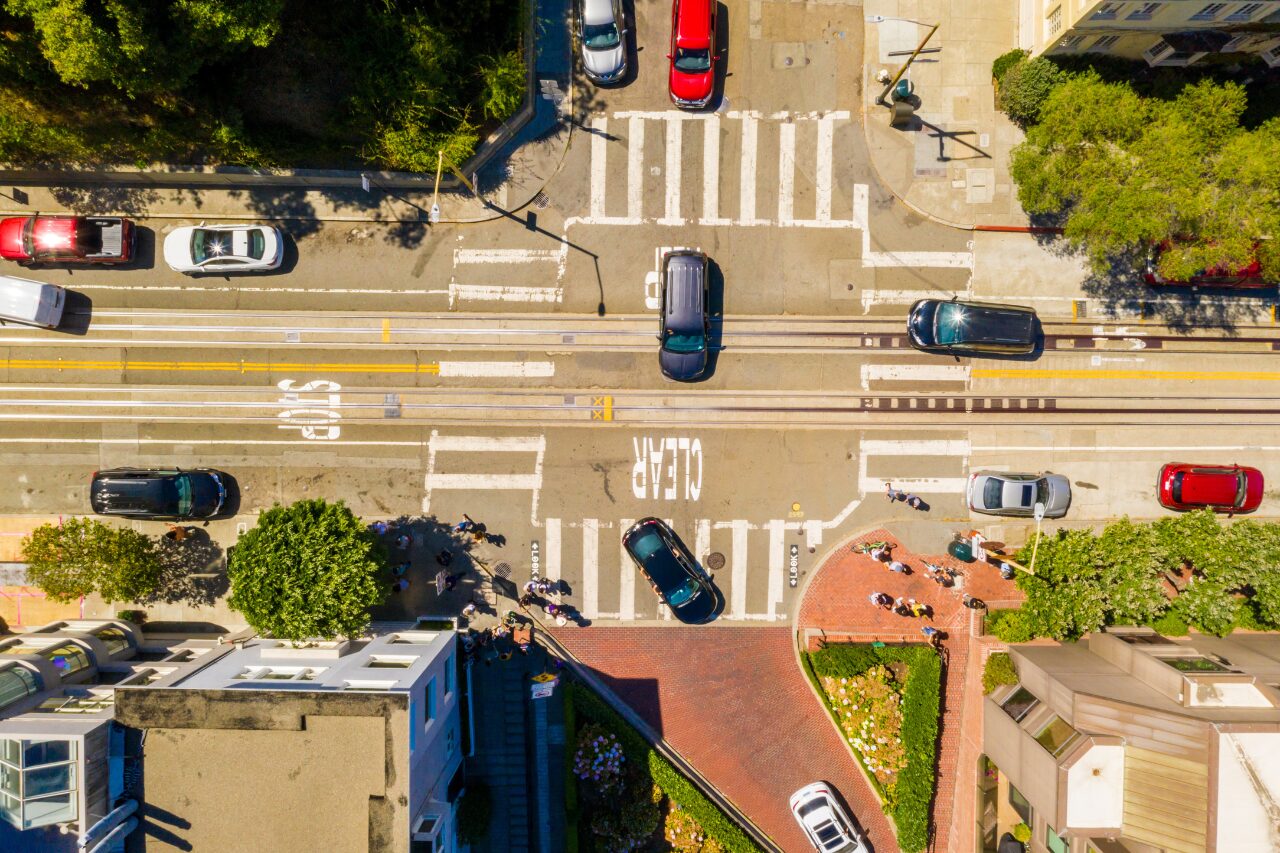 Toyota driver assistance system improving safety at busy city intersection with pedestrians and traffic