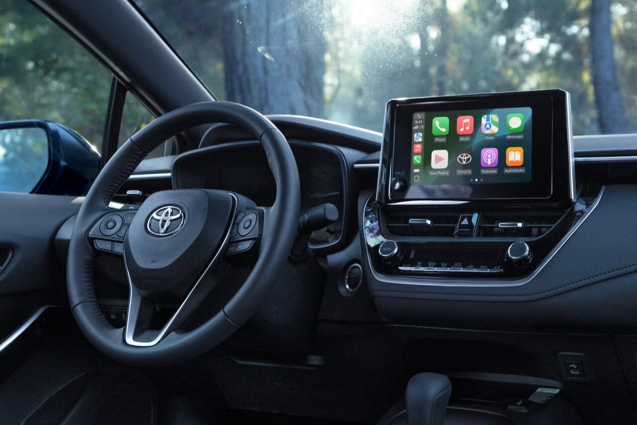 Toyota interior featuring advanced driver assistance controls and connected safety technology