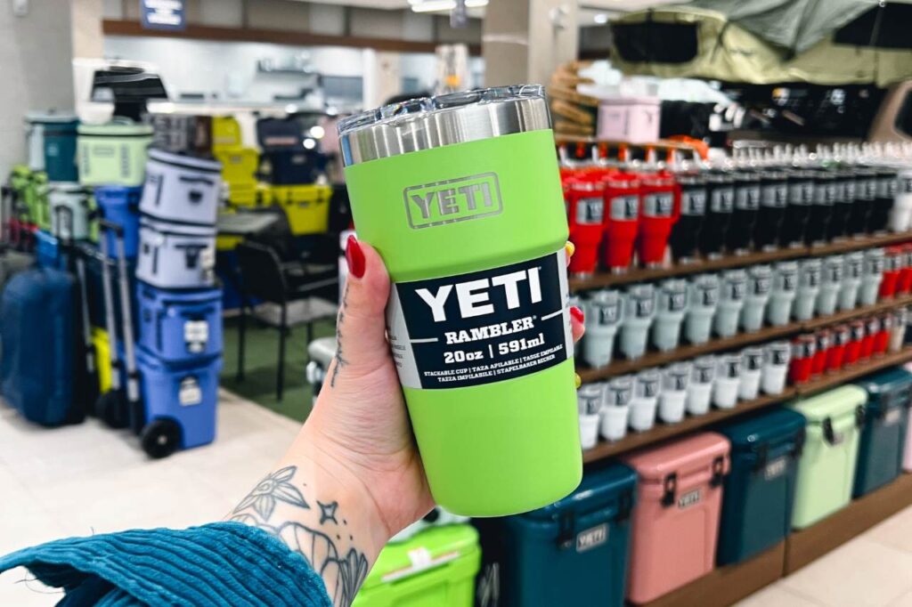 A woman holds a Venom green YETI rambler in her hands inside the West Edmonton Mall Toyota Parts Department.
