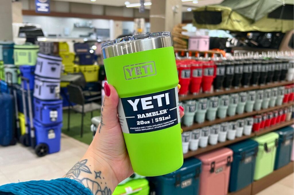 Back-to-School Shopping at West Edmonton Mall-2 A woman holds up a bright green YETI tumbler in her hand in the West Edmonton Mall Toyota parts department.