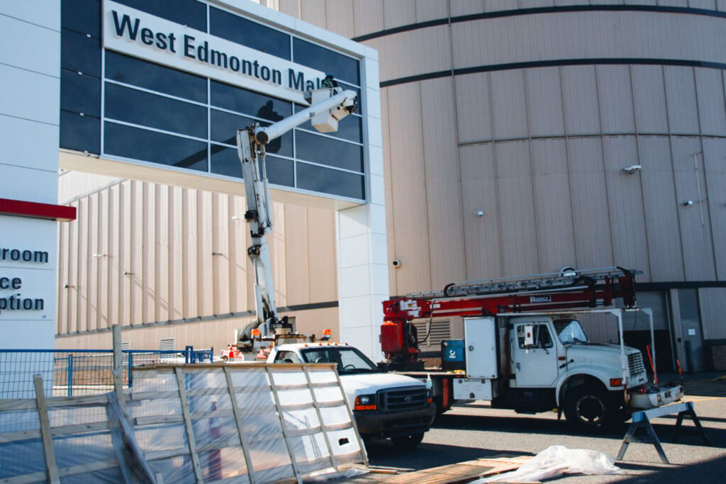 WEM Blog Images - 100 Construction crews put up the Toyota sign at West Edmonton Mall for the West Edmonton Mall grand opening in 2021.