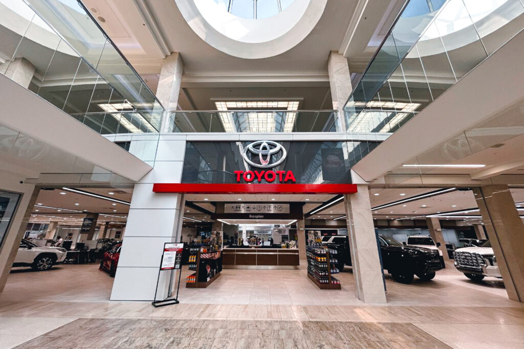 WEM Blog Images - 101 The interior of the West Edmonton Mall Toyota dealership. Showcases the reception and main entrance doors inside the mall.